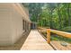 Spacious wooden back deck and exterior view at 5709 Russell Rd, Durham, NC 27712