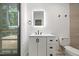 Bathroom with modern lighting, and a white vanity sink cabinet at 5709 Russell Rd, Durham, NC 27712