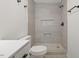 Modern bathroom features tiled shower, niches, and matte black fixtures at 5709 Russell Rd, Durham, NC 27712