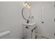 Bright bathroom showcasing vanity with matte black hardware and modern mirror at 5709 Russell Rd, Durham, NC 27712