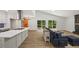 Stylish open-concept living space with an island, hardwood floors, and natural light at 5709 Russell Rd, Durham, NC 27712