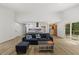 Bright, open-concept living area with vinyl floors and plenty of seating at 5709 Russell Rd, Durham, NC 27712