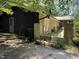 Exterior view showing a stone and black-paneled home, highlighting the architectural design at 5836 Sandstone Dr, Durham, NC 27713