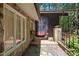 Charming front entrance featuring stone and wood exterior, a cozy sitting area and a 'welcome' sign at 5836 Sandstone Dr, Durham, NC 27713