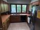 Functional kitchen featuring wood cabinets, stainless steel appliances, and a window overlooking the yard at 5836 Sandstone Dr, Durham, NC 27713