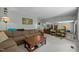 Comfortable living room featuring a large sofa and a view of the dining area at 5836 Sandstone Dr, Durham, NC 27713