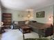 Comfortable living room with a large sectional sofa, wooden coffee table, and classic decor at 5836 Sandstone Dr, Durham, NC 27713