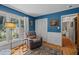 Office with a comfortable chair, good natural light, and hardwood floors at 5836 Sandstone Dr, Durham, NC 27713