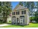 Charming two-story home featuring neutral siding, black shutters, bay windows and well-maintained landscaping at 6008 River Lake Cir, Raleigh, NC 27604