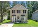 Charming two-story home featuring traditional architecture and a well-maintained front yard at 6008 River Lake Cir, Raleigh, NC 27604