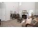 Spacious living room with high ceilings, a fireplace, and elegant furnishings for comfortable living at 6008 River Lake Cir, Raleigh, NC 27604