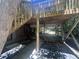 Backyard with a deck above that provides shade and a staircase to the lawn at 623 Totten Pl, Chapel Hill, NC 27514