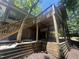 Lovely backyard with a deck that provides shade under the house and a staircase to the yard at 623 Totten Pl, Chapel Hill, NC 27514
