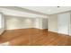 Finished basement space with hardwood floors, recessed lighting, and white trim at 623 Totten Pl, Chapel Hill, NC 27514