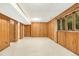 Finished basement featuring paneled walls, carpet, and a small window at 623 Totten Pl, Chapel Hill, NC 27514