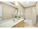 Neutral bathroom featuring a classic vanity and shower-tub combo at 623 Totten Pl, Chapel Hill, NC 27514