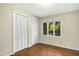 Neutral bedroom with hardwood floors and an abundance of natural light at 623 Totten Pl, Chapel Hill, NC 27514