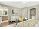 Bright bedroom featuring hardwood floors, a walk-in closet, and an ensuite bathroom at 623 Totten Pl, Chapel Hill, NC 27514