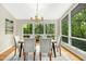 Dining room showcasing hardwood floors and a modern chandelier at 623 Totten Pl, Chapel Hill, NC 27514