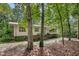 Traditional home exterior showing the landscaping with brick facade details at 623 Totten Pl, Chapel Hill, NC 27514