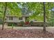 Traditional home featuring a well-maintained front yard with a red front door at 623 Totten Pl, Chapel Hill, NC 27514