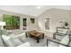 Bright living room with vaulted ceilings and windows with views of the deck and surrounding landscaping at 623 Totten Pl, Chapel Hill, NC 27514