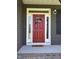 Welcoming front door with wreath and sidelights at 644 Wall Rd, Wendell, NC 27591