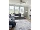 Living room with plush seating, large windows, and abundant natural light at 644 Wall Rd, Wendell, NC 27591