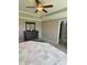 Spacious main bedroom with a decorative ceiling fan, dresser and mirror, and a doorway to the bath at 644 Wall Rd, Wendell, NC 27591