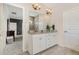 Bright bathroom featuring a double vanity with granite countertops, and wood-look tile flooring at 664 Old Dairy Dr, Wake Forest, NC 27587