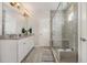Bathroom with a glass-enclosed shower and double vanity, offering both style and functionality at 664 Old Dairy Dr, Wake Forest, NC 27587