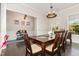 Dining room with a wooden table and decorative light fixture above at 664 Old Dairy Dr, Wake Forest, NC 27587