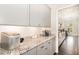 Kitchen counter featuring light gray cabinetry and granite countertops at 664 Old Dairy Dr, Wake Forest, NC 27587