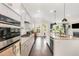 Kitchen with an island, granite counters, stainless steel appliances, and an open concept at 664 Old Dairy Dr, Wake Forest, NC 27587