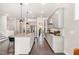 Open concept kitchen with granite countertops, gray cabinets, and stainless steel appliances at 664 Old Dairy Dr, Wake Forest, NC 27587