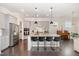 Kitchen with an island, stainless steel appliances, gray cabinetry, and hardwood flooring at 664 Old Dairy Dr, Wake Forest, NC 27587