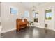 Living room with wood floors, natural light, and a piano at 664 Old Dairy Dr, Wake Forest, NC 27587