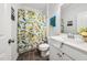 Bathroom featuring a lemon-themed shower curtain, vanity and modern sink at 7301 Villoria Ln, Raleigh, NC 27617