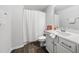 Well-lit bathroom with tiled floors, modern vanity, and shower with tasteful decor creating a refreshing space at 7301 Villoria Ln, Raleigh, NC 27617