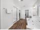 Bright bathroom with a glass-enclosed shower, soaking tub, and double vanity at 7301 Villoria Ln, Raleigh, NC 27617