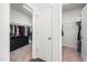 View of two walk-in closets with ample hanging space and shelving at 7301 Villoria Ln, Raleigh, NC 27617