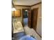 Bathroom with double sinks and countertop with a view of the bedroom at 759 Wheeler Dr, Angier, NC 27501