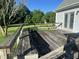 Wooden deck with railing and seating, perfect for outdoor entertaining and enjoying the scenic views at 759 Wheeler Dr, Angier, NC 27501