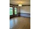 Bright dining room featuring wood floors, decorative trim and large windows at 759 Wheeler Dr, Angier, NC 27501