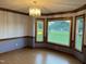 Dining room featuring wood floors, decorative trim and large windows with a view at 759 Wheeler Dr, Angier, NC 27501