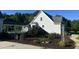 A two-story home with charming architectural details and professionally landscaped surroundings at 759 Wheeler Dr, Angier, NC 27501