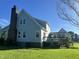 Charming two-story home with a brick chimney, a wooden deck, and a lush green lawn at 759 Wheeler Dr, Angier, NC 27501