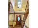 Inviting foyer with staircase and a wooden front door with oval glass at 759 Wheeler Dr, Angier, NC 27501