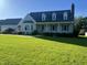 Charming home with lush lawn, dormer windows, and a welcoming front porch, perfect curb appeal at 759 Wheeler Dr, Angier, NC 27501