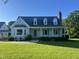 Charming Cape Cod home with well-manicured lawn and inviting front porch at 759 Wheeler Dr, Angier, NC 27501
